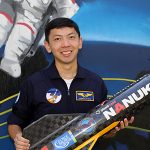 Jeremy Wang holding a rocket