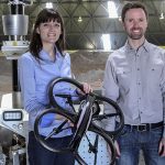 Professors Angela Schoellig and Tim Barfoot with a drone