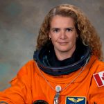 Julie Payette poses in her space suit