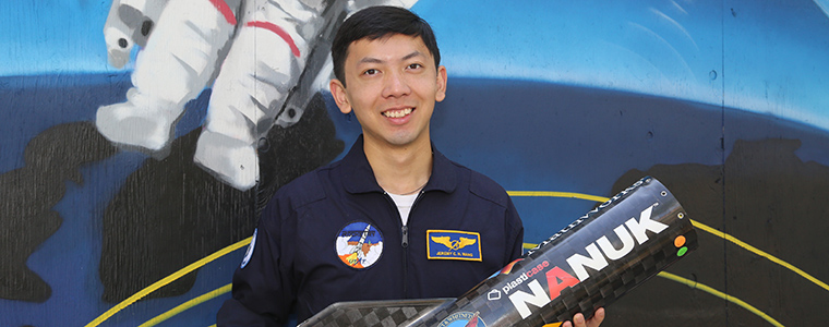  Jeremy Wang holding a rocket
