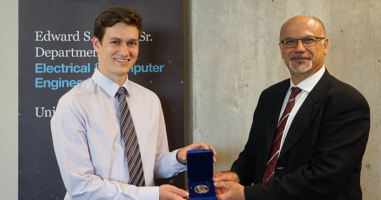 Sandro Young accepting Governor General’s Silver Medal from Professor Farid Najm