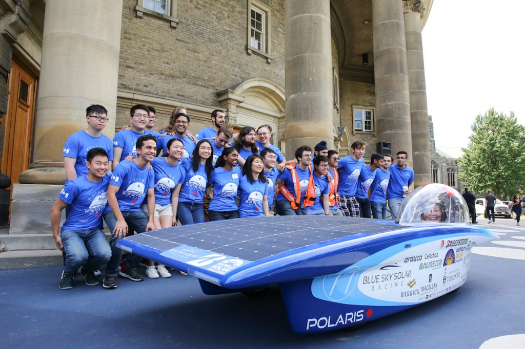 The Blue Sky Solar Racing Team pose with their vehicle