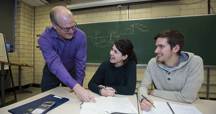 Greg Evans teaching students