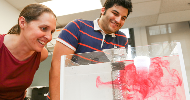 Professor Amy Bilton in a lab with a grad student